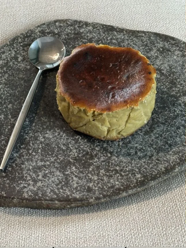 A whole Pistachio tartza, pale green inside a burnt top